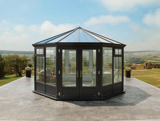 Double pane Nordic-style garden room greenhouse with insulated glass panels used for year-round growing and outdoor living