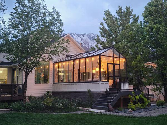 A large glass greenhouse in a residential setting, the kind of structure that may require a building permit