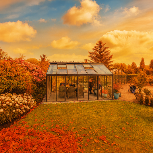 A Livingten Greenhouse surrounded by autumn foliage, designed with insulated panels for warmth and smart ventilation for fall and winter gardening.