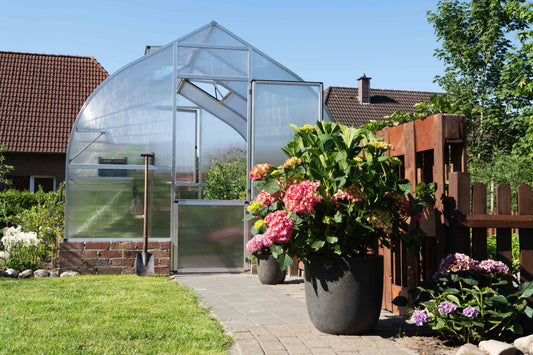 Hoklartherm Riga greenhouse in a home garden