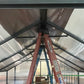 Nelke roof framing with turnbuckle cross supports seen from inside