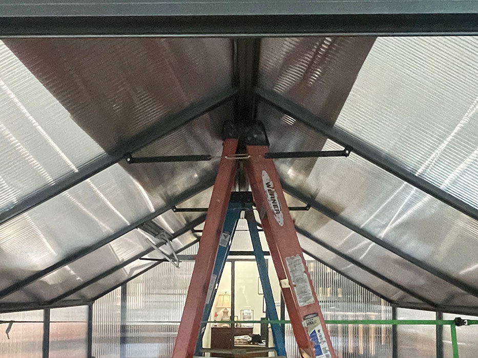 Nelke roof framing with turnbuckle cross supports seen from inside