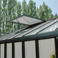 Close-up of the 4 mm tempered safety glass roof panes, rubber-sealed glazing bars and roof vent on a black Janssens greenhouse