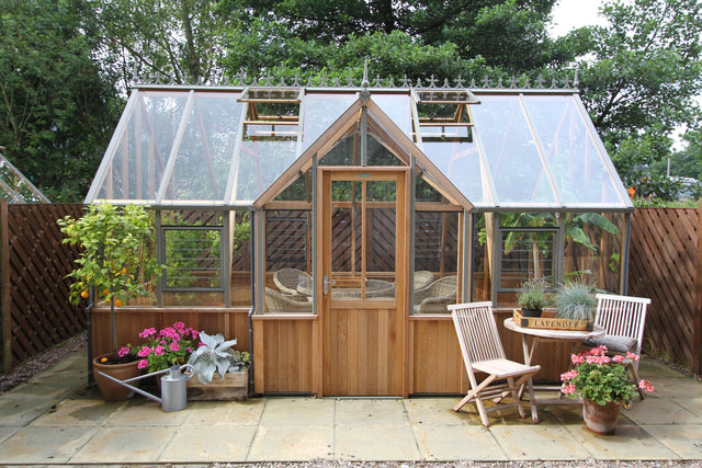 Front view of the Alton Cambridge T-shaped cedar orangerie with double doors and opening roof vents