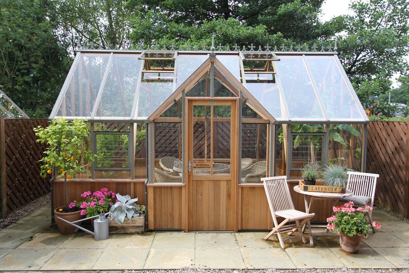 Front view of the Alton Cambridge T-shaped cedar orangerie with double doors and opening roof vents