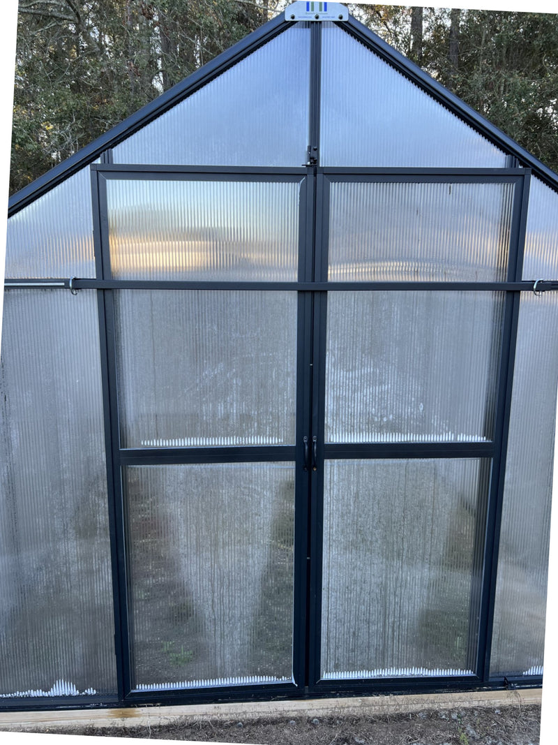 Close-up of the door lock on a Riverstone MONT greenhouse