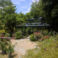 Cathedral Victorian Orangerie surrounded by flowering shrubs