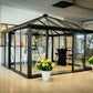 Janssens Pyramid glass greenhouse with black frame set up as a glass room in the Janssens showroom