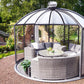 Hoklartherm Rondo glass garden pavilion with dome roof and dark grey frame on a gravel circle, furnished with a wicker lounge set