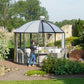 Rondo pavilion with dome roof and walls turned open toward a stone garden
