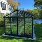 Royal Victorian VI36 glass greenhouse in a backyard, front view