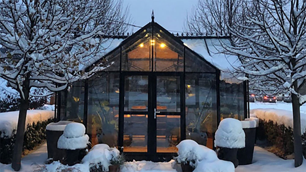 Janssens T-Shaped Royal Victorian Orangerie glowing in winter snow