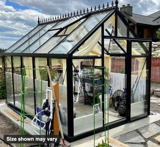 Janssens Junior Victorian greenhouse on a patio with roof cresting (size shown may vary)