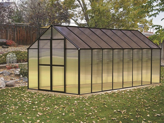 Riverstone MONT 8x16 greenhouse with a black frame in a backyard with autumn leaves