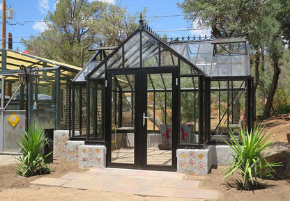 Black EOS T-shaped Royal Antique Victorian greenhouse on a low wall base
