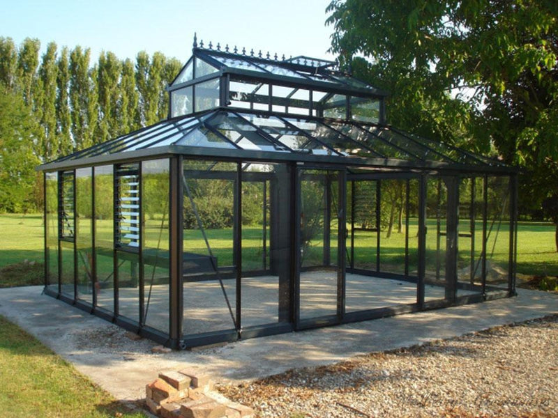 Black Janssens Cathedral Victorian Orangerie on a stone patio