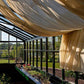 Inside the Retro Royal Victorian greenhouse with shade curtains drawn