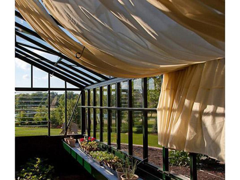 Inside the Retro Royal Victorian greenhouse with shade curtains drawn