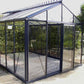 Smaller model shown – empty Royal Victorian glass greenhouse on a gravel base